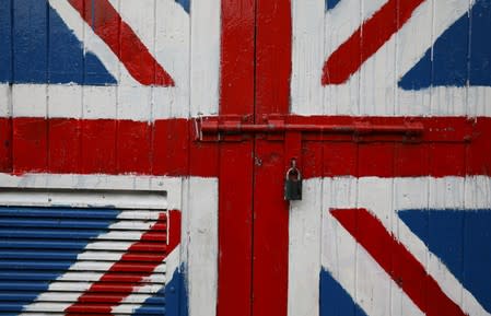 A padlock is seen on a door covered with a Union Jack mural on the Fountain Estate in Londonderry, Northern Ireland