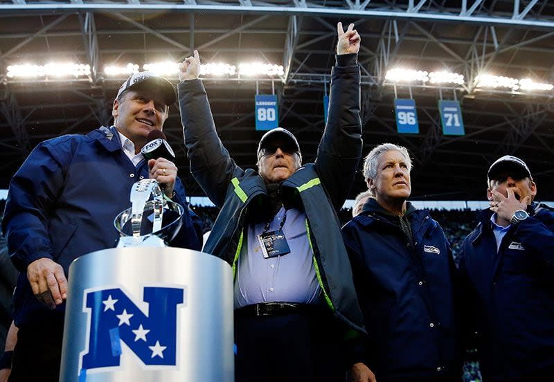 SEATTLE, WA - JANUARY 18:  Seattle Seahawks owner Paul Allen and head coach Pete Carroll of the Seattle Seahawks celebrate after the Seahawks defeated the Green Bay Packers in the 2015 NFC Championship game at CenturyLink Field on January 18, 2015 in Seattle, Washington.  (Photo by Tom Pennington/Getty Images)