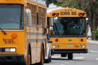 School bus drivers take part in caravan to demand proper funding for schools to support distant learning and a safe return to classes, in Los Angeles