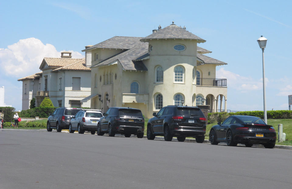 Cars are parked on an oceanfront street in Deal, N.J., on May 15, 2021. The Jersey shore town has introduced a law that would restrict parking on many streets closest to the ocean to residents-only. Some shore towns in New Jersey and other states have used parking restrictions as a way to keep outsiders off their beaches. (AP Photo/Wayne Parry)