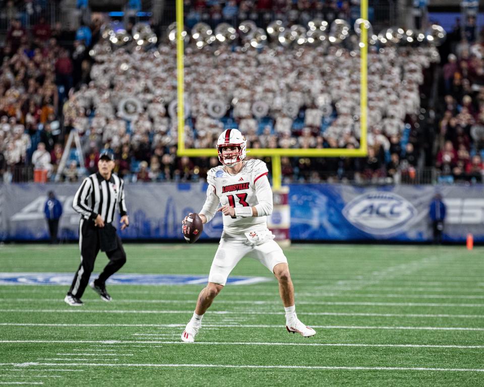 Louisville quarterback Jack Plummer (13) rolled out to pass as the Louisville Cardinals faced off against the Florida State Seminoles at Bank of America Field in Charlotte, NC. FSU defeated Louisville 16-6 to win the 2023 ACC Championship. Dec. 2, 2023.