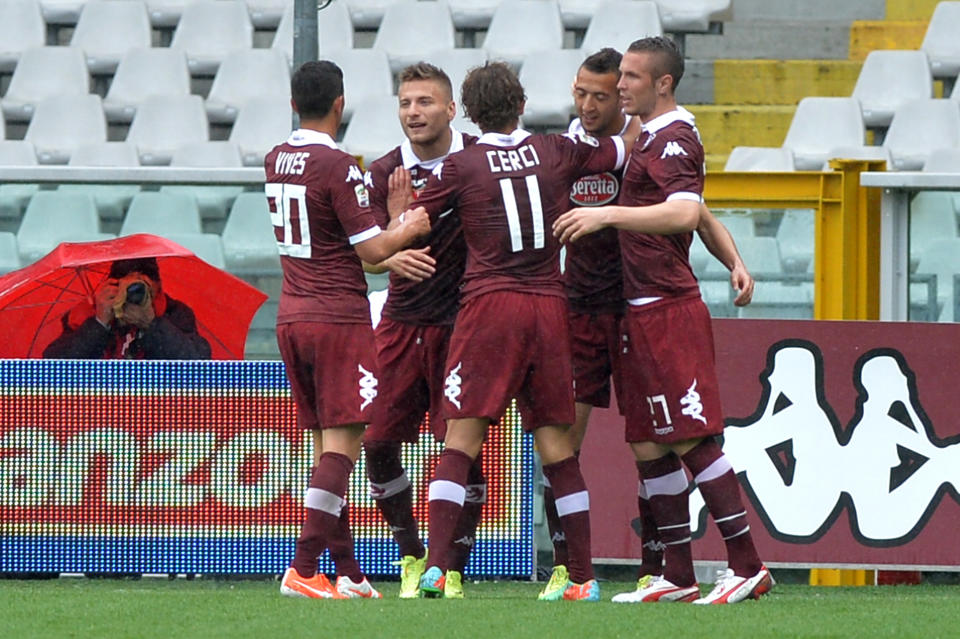 Torino' forward Omar El Kaddouri, second from right, celebrates with teammates after scoring during a Serie A soccer match between Torino and Udinese at the Olympic stadium, in Turin, Italy, Sunday, Apr 27, 2014. (AP Photo/ Massimo Pinca)