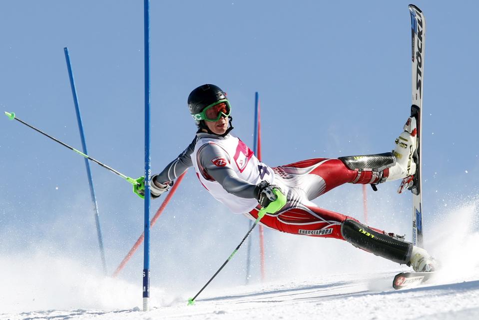 Andrzej Grygiel, a Polish photographer working for PAP-Polska Agencja Prasowa won the 2nd Prize Sports Action Single category of the 2014 World Press Photo contest with this picture of a skier competing on the slalom modality in Szczyrk, taken March 24, 2013. REUTERS/Andrzej Grygiel/World Press Photo Handout via Reuters