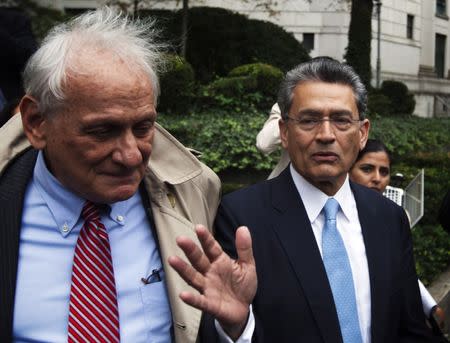 Former Goldman Sachs Group Inc board member Rajat Gupta (R) departs Manhattan Federal Court with his lawyer, Gary Naftalis (L) after being sentenced in New York, October 24, 2012. REUTERS/Lucas Jackson