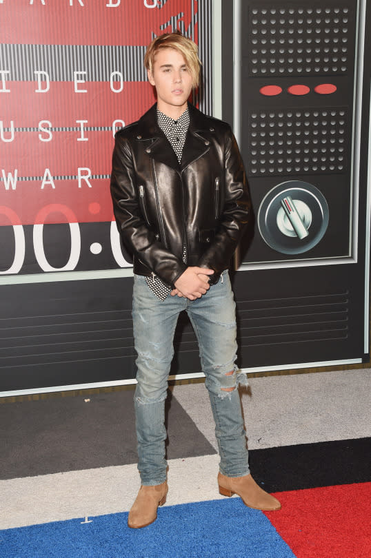 <p>The “What Do You Mean” singer, famous for his hair, debuted a new ‘do on the lavender carpet. The exaggerated side swept bang, a 2015 version of his former mop, was certainly the centerpiece, but his outfit was awesome as well. Wearing a leather jacket, he had on a black and white patterned button down underneath, which he paired with ripped jeans and suede boots.</p>