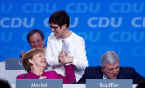 German Chancellor Angela Merkel congratulates Annegret Kramp-Karrenbauer after her speech at a Christian Democratic Union (CDU) party congress in Berlin, Germany, February 26, 2018. REUTERS/Hannibal Hanschke