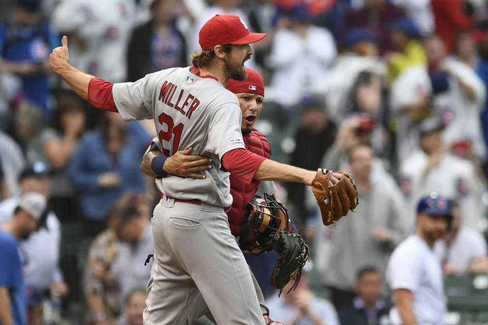 St. Louis Cardinals closing pitcher Andrew Miller (21) celebrates with catcher Yadier Molina after defeating the the Chicago Cubs in a baseball game Sunday, Sept. 22, 2019, in Chicago. (AP Photo/Paul Beaty)