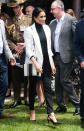 <p>For a reception hosted by the Prime Minister of Australia at The Pavilion Restaurant, Meghan paired her striped Oroton crossbody bag with Aquazzura pumps, a turtleneck, a £510 blazer by L’Agence and go-to £159 Mother Denim jeans. <em>[Photo: Getty]</em> </p>