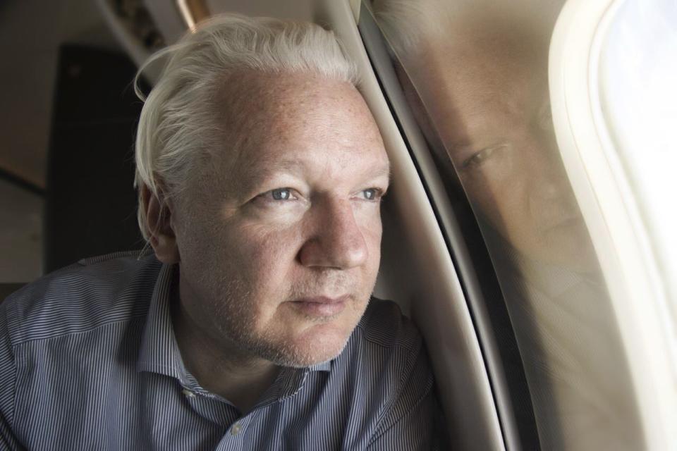 FILE - This screen grab from the X account of Wikileaks shows Julian Assange on board a flight to Bangkok, Thailand, following his release from prison on Tuesday June 25, 2024. The abrupt guilty plea by WikiLeaks founder Julian Assange was the culmination of negotiations that began a year and a half ago and accelerated in recent months.(@WikiLeaks, via AP)