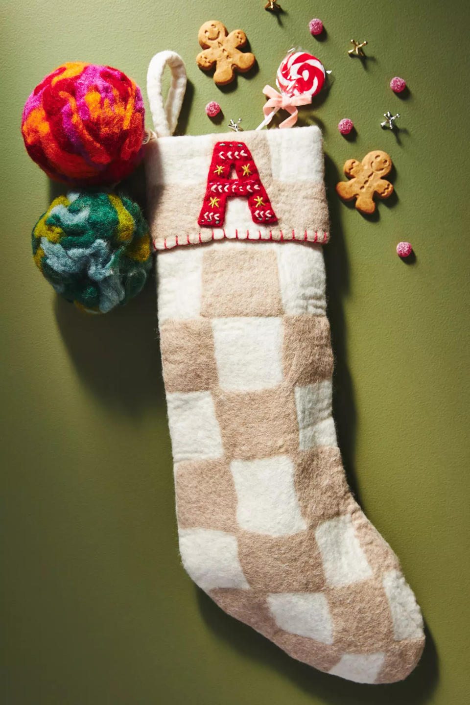 a stocking with little decor pieces surrounding it