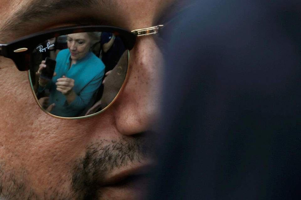 Clinton is reflected in a supporter’s sunglasses