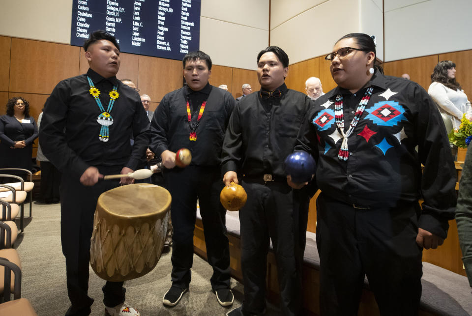 The Black Mesa Singers, of New Mexico's San Felipe Pueblo, perform during the opening day of an annual legislative session in the House of Representatives in Santa Fe, N.M., Tuesday, Jan. 17, 2023. The Democratic-led Legislature prepared to tap a multibillion-dollar budget surplus as they take on daunting challenges of crime, lagging student achievement in schools and below-average workforce participation. (AP Photo/Andres Leighton)