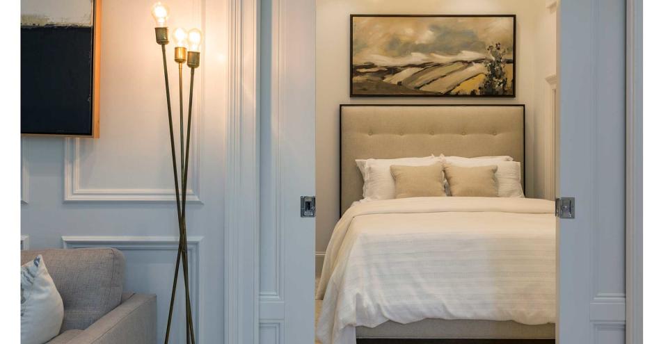 living room with pocket doors leading through to a bedroom to show the modern pocket door design trend