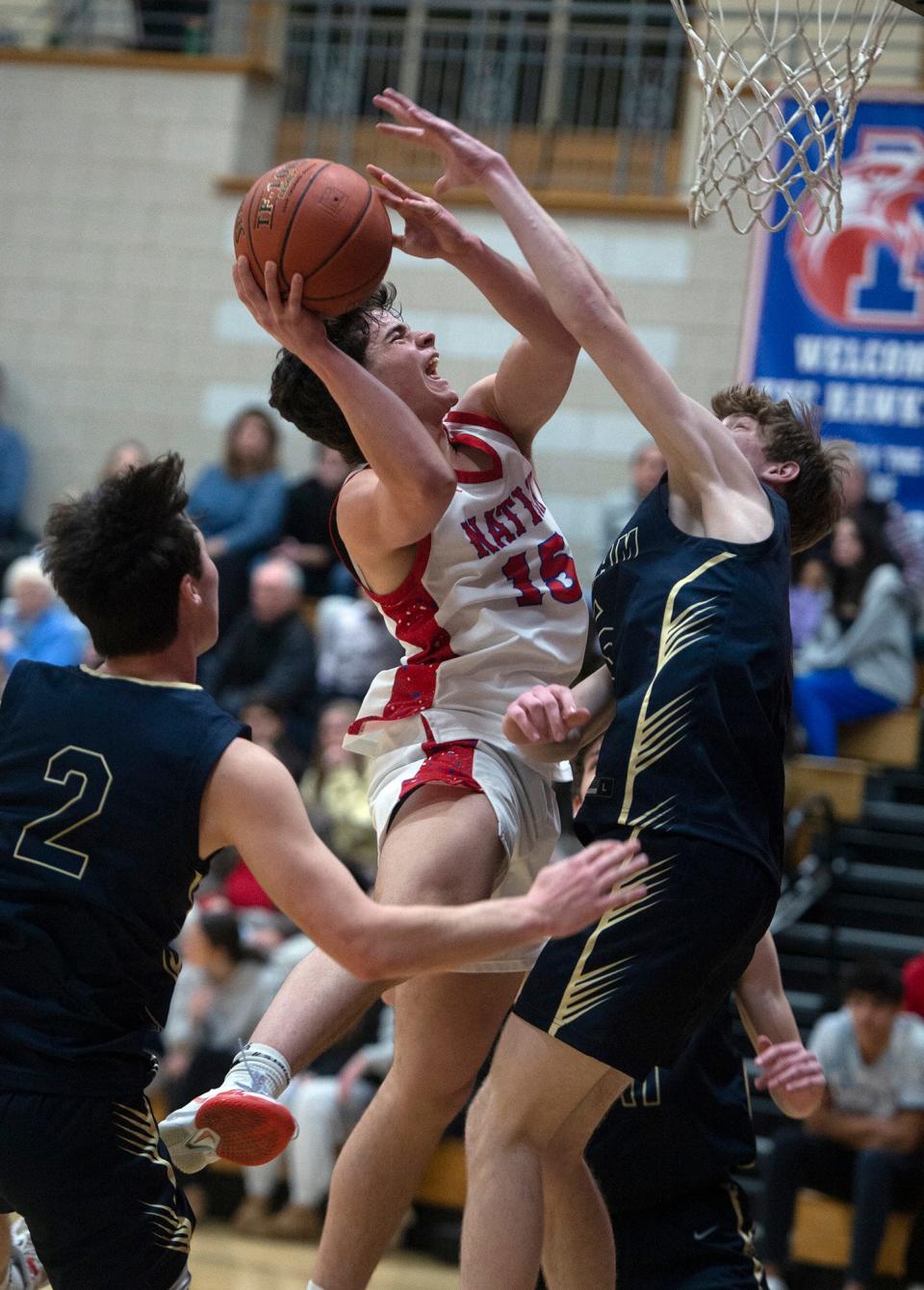 Natick High School junior Dante Jeremic in traffic against Needham, Jan. 19, 2024.