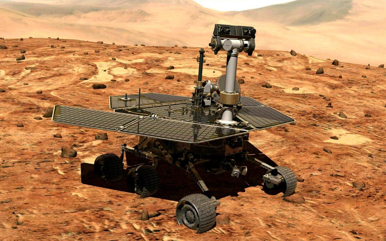 An illustration made available by NASA shows the rover Opportunity on the surface of Mars - NASA