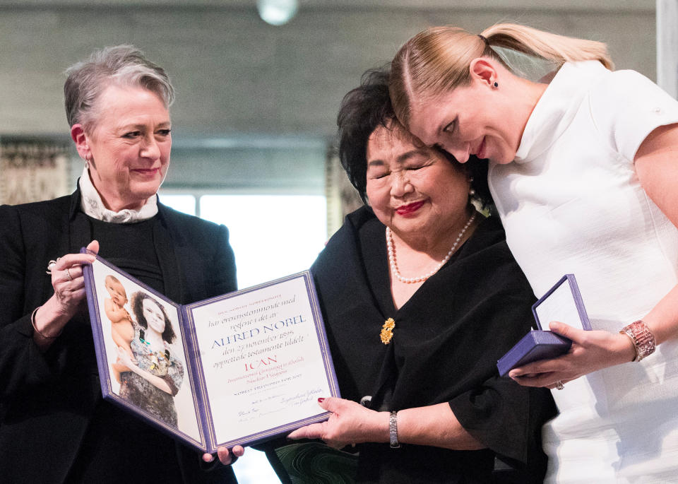 Beatrice Fihn, executive&nbsp;director of the International Campaign to Abolish Nuclear Weapons, embraces&nbsp;Hiroshima survivor Setsuko Thurlow (center)&nbsp;during the Nobel Peace Prize's award ceremony on Sunday.&nbsp;Berit Reiss-Andersen, leader of the Nobel Committee, stands to the left. (Photo: Norsk Telegrambyra AS / Reuters)