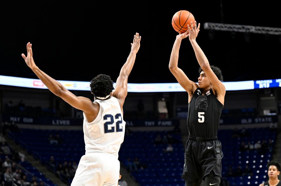 Max Christie (5) of the Michigan State Spartans shoots the ball in the first half against Jalen Pickett (22) of the Penn State Nittany Lions at Bryce Jordan Center on February 15, 2022 in University Park, Pennsylvania.