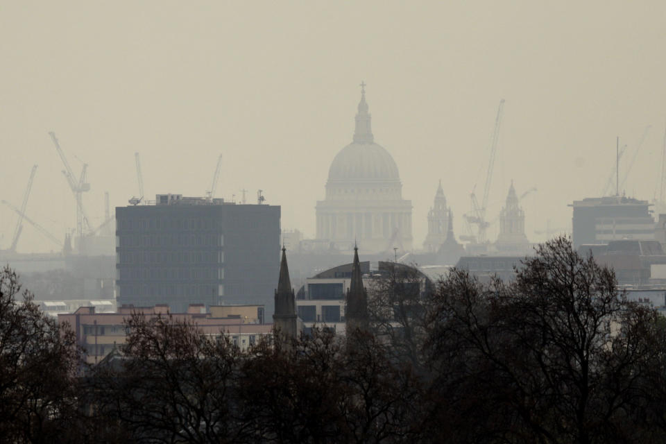 St Paul's Cathedral stands shrouded in smog as seen from Primrose Hill in London, Thursday, April 3, 2014. European pollution and dust swirling in from the Sahara created a "perfect storm" of smog in Britain on Wednesday, prompting authorities to warn people with heart or lung conditions to cut down on tough physical exercise outdoors. Air pollution in some areas reached the top rung on its 10-point scale, the environment department said. (AP Photo/Matt Dunham)