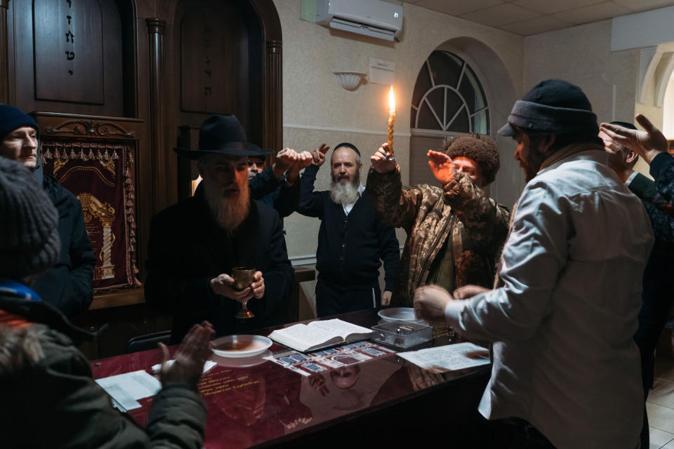 Rabbi David Goldich blesses the wine during sabbath prayer at the Great Choral Synagogue in Kyiv on Dec. 10, 2022.<span class="copyright">Anastasia Vlasova—The Washington Post/Getty Images</span>