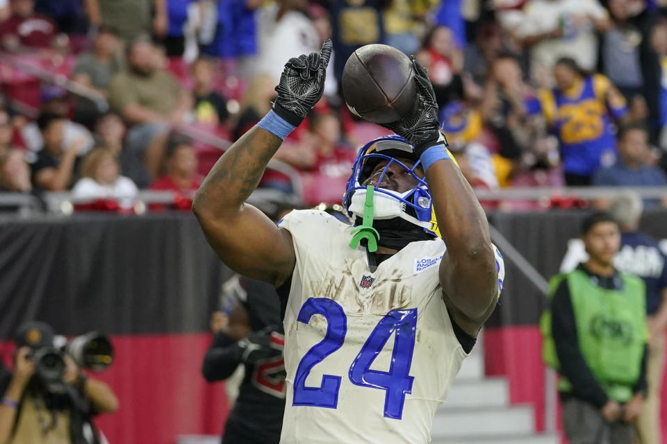 Los Angeles Rams running back Royce Freeman celebrates after scoring a touchdown during the second half of an NFL football game against the Arizona Cardinals, Sunday, Nov. 26, 2023, in Glendale, Ariz. (AP Photo/Matt York)