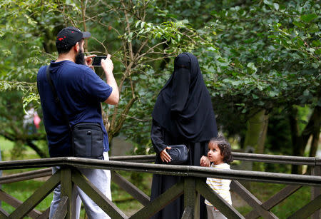 Tourists from the Middle East take pictures at Vrelo Bosne nature park in Ilidza near Sarajevo, Bosnia and Herzegovina, August 19, 2016. Picture taken August 19, 2016. REUTERS/Dado Ruvic