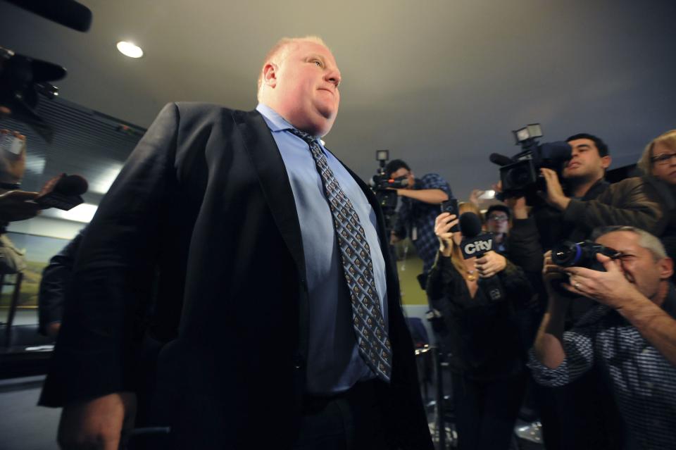 Toronto Mayor Rob Ford leaves his City Hall office to return to a city council meeting after a brief recess in Toronto November 15, 2013. The embattled mayor, under huge pressure to quit after he admitted smoking crack cocaine, said on Thursday he was getting help for a drinking problem, but offered no indication that he might step down. REUTERS/Jon Blacker (CANADA - Tags: POLITICS CRIME LAW)