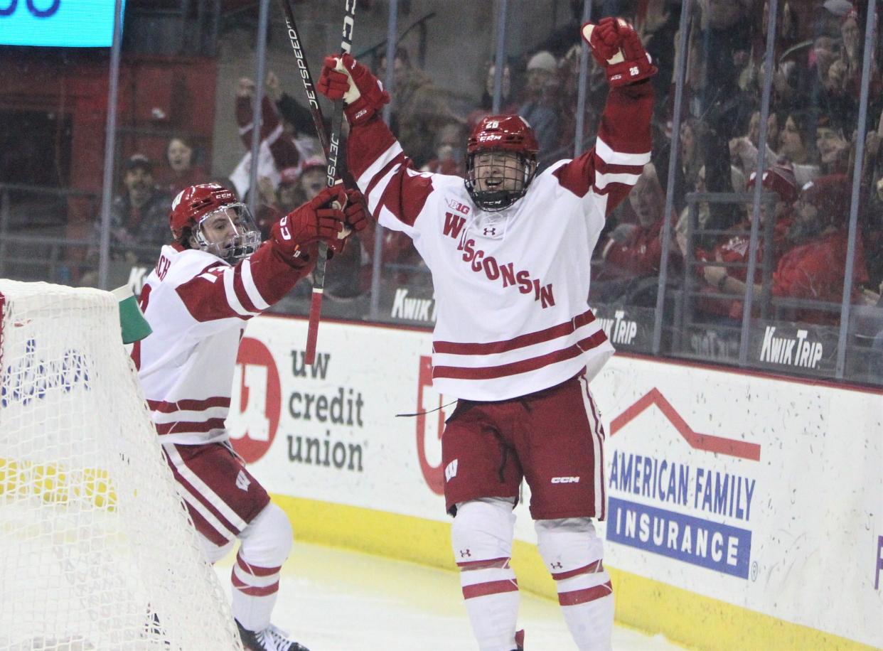 Wisconsin's Luke LaMaster (right) celebrates with Jack Horbach after scoring the first goal of the team's 4-0 victory over Ohio State Friday Jan. 20, 2023 at the Kohl Center in Madison, Wis.