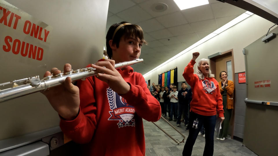 Students lined the halls to welcome Dr. Kinneman with some even playing musical instruments.