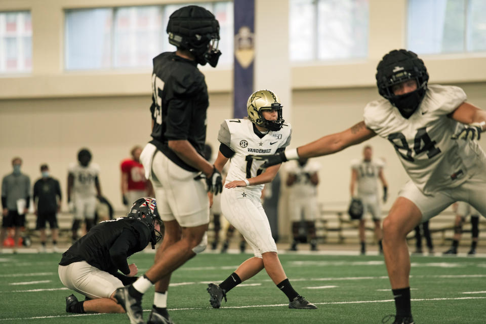 In this image provided by Vanderbilt Athletics, Vanderbilt kicker Sarah Fuller watches a kick during NCAA college football practice, Wednesday, Nov. 25, 2020, in Nashville, Tenn. Fuller, a goalkeeper on the Commodores' women's soccer team, will don a football uniform on Vanderbilt's sideline and she is poised to become the first woman to play in a Power 5 game when the Commodores take on Missouri. (Vanderbilt Athletics via AP)