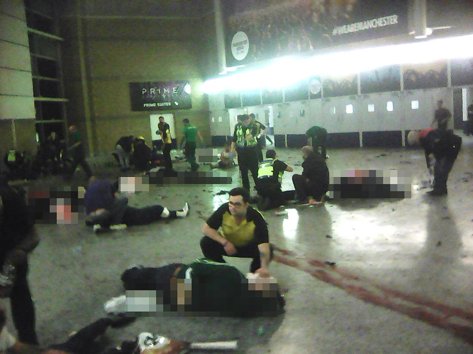 Paramedics attend to casualties inside Manchester Arena after Salman Abedi detonated his bomb: PA wire