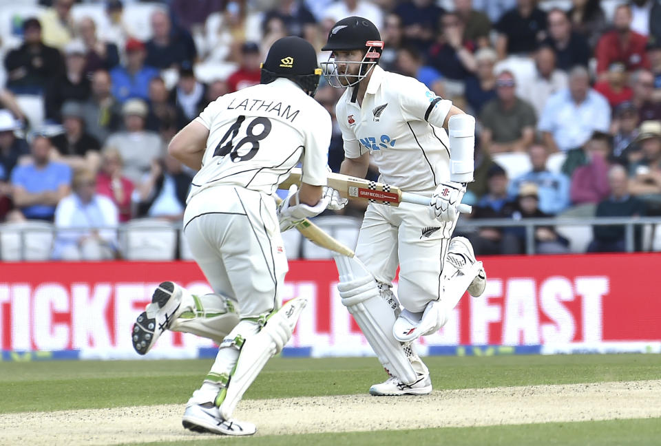 New Zealand's Kane Williamson, right, and New Zealand's Tom Latham run between wickets during the third day of the third cricket test match between England and New Zealand at Headingley in Leeds, England, Saturday, June 25, 2022.. (AP Photo/Rui Vieira)