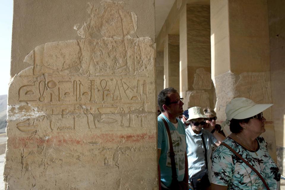 Foreign tourists visit the Hatshepsut Temple, in Luxor, Egypt, Wednesday, Feb. 27, 2013. Nineteen people were killed Tuesday in what appeared to be the deadliest hot air ballooning accident on record. The tragedy raised worries of another blow to the nation's vital tourism industry, decimated by two years of unrest since the 2011 revolution that toppled autocrat Hosni Mubarak. The southern city of Luxor has been hit hard, with vacant hotel rooms and empty cruise ships.(AP Photo/Nasser Nasser)