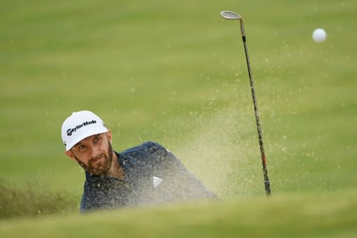 Dustin Johnson of the US plays a shot from a bunker on the 11th hole during a practice round prior to the 2018 US Open, at Shinnecock Hills Golf Club in Southampton, New York, on June 13