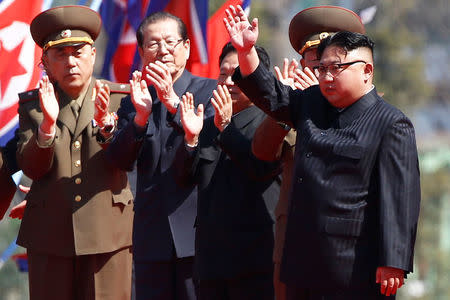 North Korean leader Kim Jong Un waves to people cheering during an opening ceremony of a newly constructed residential complex in Ryomyong street in Pyongyang, North Korea April 13, 2017. REUTERS/Damir Sagolj