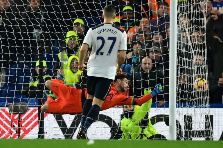 The ball flies past Tottenham Hotspur's goalkeeper Hugo Lloris (L) to slam into the back of the net from a shot from Chelsea's midfielder Pedro on November 26, 2016