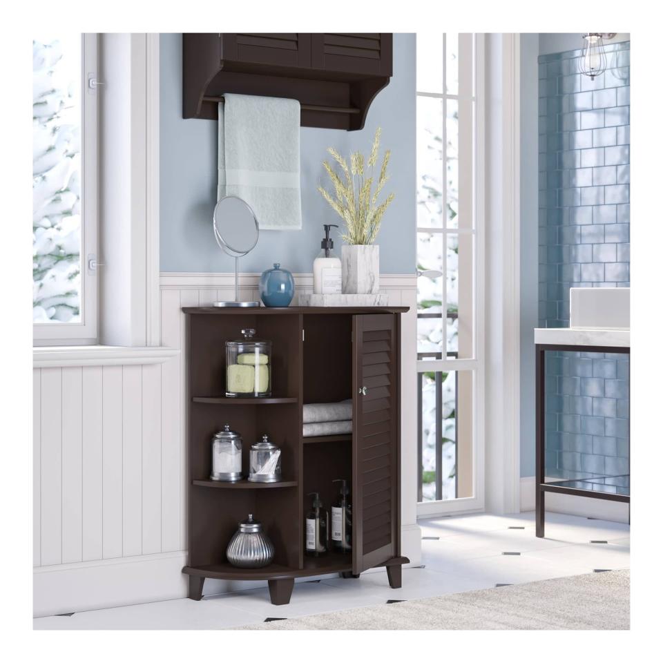 <p>The <span>RiverRidge Home Ellsworth Floor Cabinet with Side Shelves</span> ($71) is an elegant free standing cabinet that will add ample storage to your bathroom. It has a three-tiered open shelving section and a two interior adjustable shelves. </p>