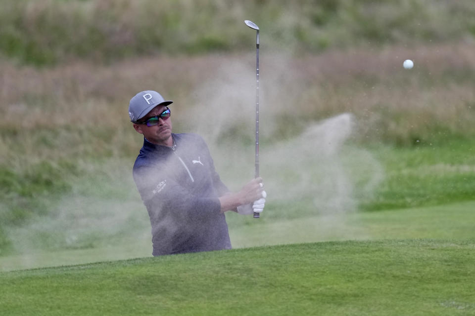 United States' Rickie Fowler hits out of a bunker on the 18th green during the second day of the British Open Golf Championships at the Royal Liverpool Golf Club in Hoylake, England, Friday, July 21, 2023. (AP Photo/Kin Cheung)