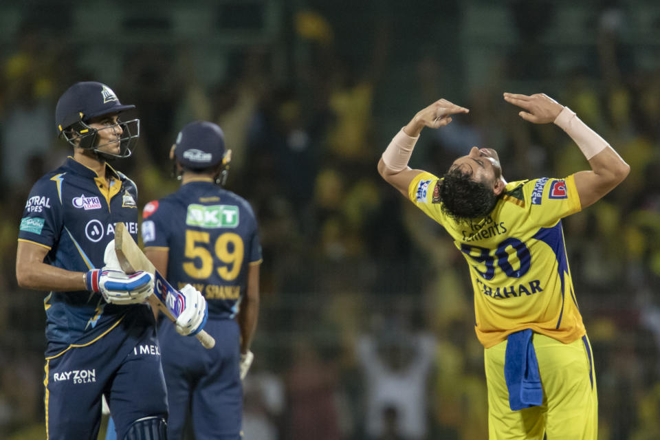 Chennai Super Kings' Deepak Chahar celebrates the wicket of Gujrat Titans' Shubman Gill, left, during the Indian Premier League qualifier cricket match between Chennai Super Kings and Gujrat Titans in Chennai, India, Tuesday, May 23, 2023. (AP Photo /R. Parthibhan)