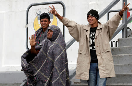 Migrants from Honduras, part of the caravan traveling from Central America en route to the United States, gesture on a tribune at a sport centre used as a shelter, in Mexico City, Mexico November 4, 2018. REUTERS/Henry Romero