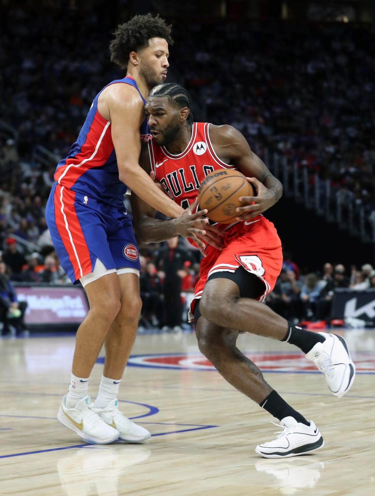 Detroit Pistons guard Cade Cunningham (2) defends against Chicago Bulls forward Patrick Williams (44) during second-quarter action at Little Caesars Arena in Detroit on Saturday, Oct. 28, 2023.