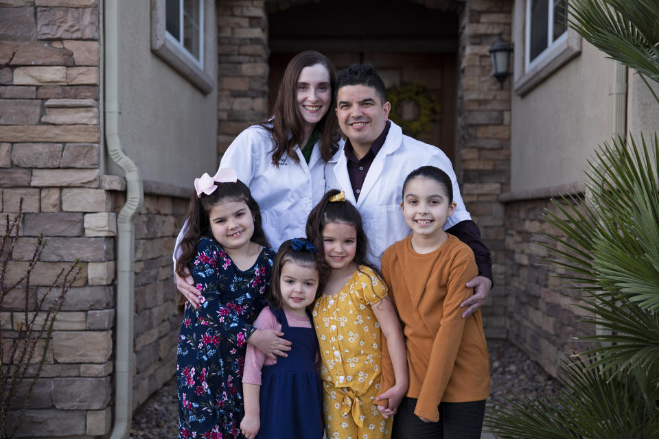 Image: Marilyn and Shane Jerominski with their children, from left, Shaela, 7, Shia, 3, Shiloh, 5, and Shalyn, 9, at their home in Indio, Calif., on Feb. 19, 2021. (Jenna Schoenefeld / NBC News)