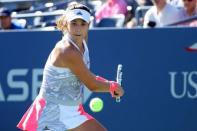 Aug 29, 2016; New York, NY, USA; Garbine Muguruza of Spain returns a shot to Elise Mertens of Belgium on day one of the 2016 U.S. Open tennis tournament at USTA Billie Jean King National Tennis Center. Anthony Gruppuso-USA TODAY Sports