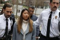 Inyoung You arrives at Suffolk Superior Court in Boston, Friday, Nov. 22, 2019. Prosecutors say You sent her boyfriend Alexander Urtula more than 47,000 text messages in the last two months of their relationship, including many urging him to "go kill yourself." (AP Photo/Michael Dwyer)