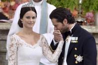 FILE PHOTO - Swedish Prince Carl Philip kisses the hand of Sofia Hellqvist during the exchange of vows and rings at their wedding in the Royal Chapel in Stockholm, Sweden, June 13, 2015. REUTERS/Claudio Bresciani/TT News Agency