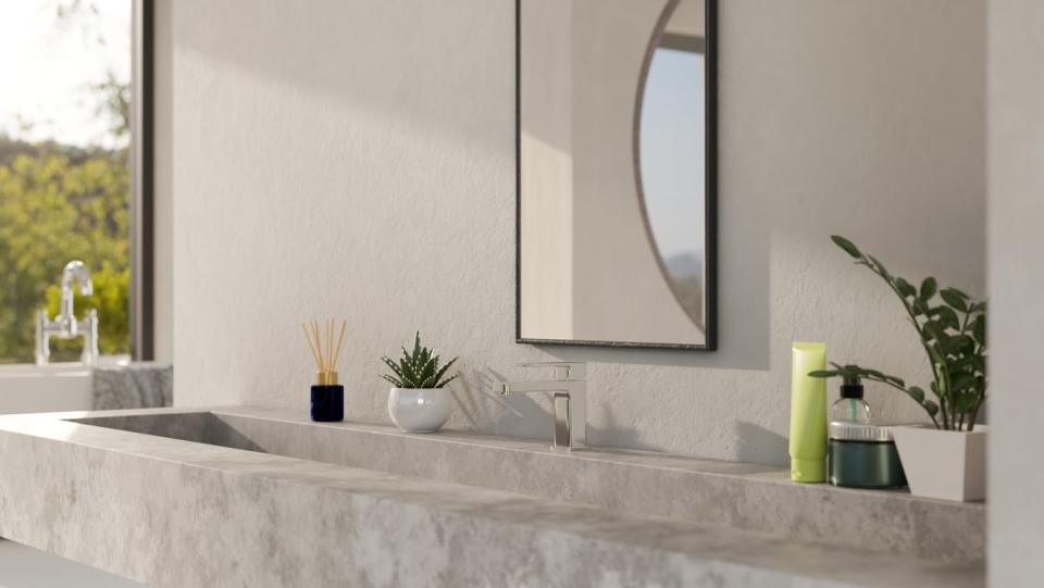 Concrete countertops are the focus in this photo of a modern bathroom. 