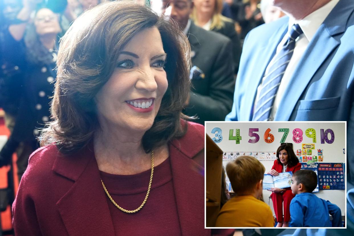 New York Governor Kathy Hochul greets people as she arrives to deliver her State of the State address