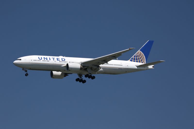 FILE PHOTO: A United Airlines Boeing 777-200 lands at San Francisco International Airport, San Francisco