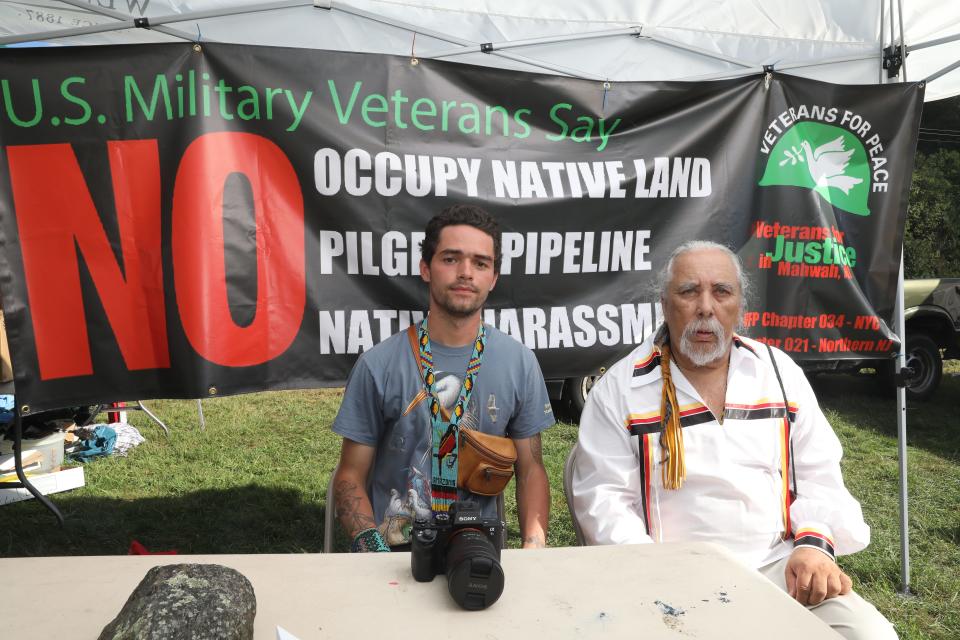 Brooklyn Demme, left, son of the late filmmaker Jonathan Demme, who is making a film about the travails of the Ramapough Lenape Indians stands with Chief Dwaine Perry at SallyÕs field at Ringwood state park in Ringwood, New Jersey. The Ramapough Lenape Indians are struggling with the township of Mahwah over the use of their land.
(Photo: Carucha L. Meuse/The Journal News)