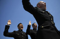 <p>U.S. Naval Academy midshipmen raise their right hands as they are commissioned as second lieutenants in the U.S. Marine Corp during the Academy’s graduation and commissioning ceremony, Friday, May 25, 2018, in Annapolis, Md. (Photo: Patrick Semansky/AP) </p>