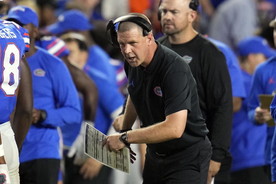 Florida head coach Billy Napier encourages his players during the first half of an NCAA college football game against McNeese State, Saturday, Sept. 9, 2023, in Gainesville, Fla. (AP Photo/John Raoux)